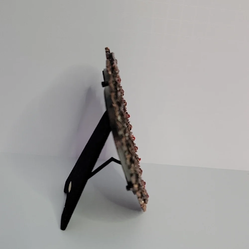 Heart-Shaped Bronze Frame with Red Accents